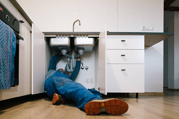 Professional Emergency Plumber technician working in Winchester, MA